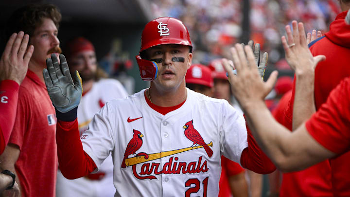 Jun 5, 2025; St. Louis, Missouri, USA;  St. Louis Cardinals left fielder Lars Nootbaar (21) is congratulated by teammates after scoring against the Kansas City Royals during the first inning at Busch Stadium. Mandatory Credit: Jeff Curry-Imagn Images