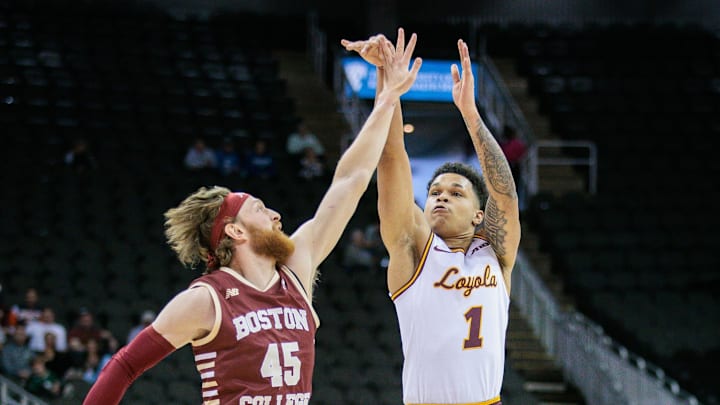 Nov 23, 2023; Kansas City, Missouri, USA; Loyola (Il) Ramblers guard Jayden Dawson (1) puts up a shot over Boston College Eagles guard Mason Madsen (45) during the second half at T-Mobile Center. Mandatory Credit: William Purnell-Imagn Images