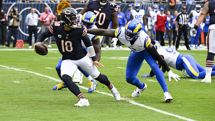 Sep 29, 2024; Chicago, Illinois, USA;  Los Angeles Rams linebacker Jared Verse (8) chases Chicago Bears quarterback Caleb Williams (18) during the first half at Soldier Field. Mandatory Credit: Matt Marton-Imagn Images