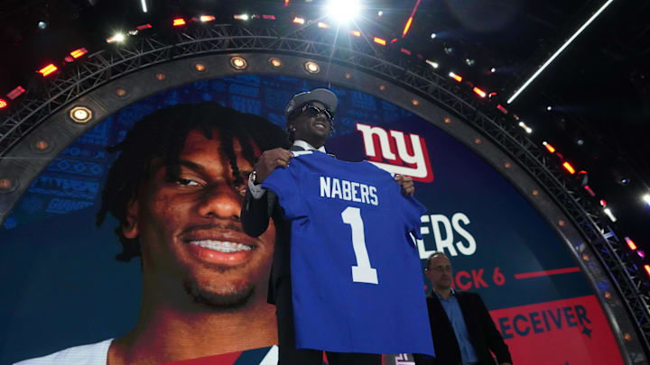 Apr 25, 2024; Detroit, MI, USA; LSU Tigers wide receiver Malik Nabers poses with jersey after being selected as the No. 8 pick by the New York Giants during the 2024 NFL Draft at Campus Martius Park and Hart Plaza. Mandatory Credit: Kirby Lee-USA TODAY Sports