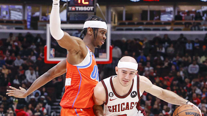 Jan 13, 2023; Chicago, Illinois, USA; Chicago Bulls guard Alex Caruso (6) drives to the basket against Oklahoma City Thunder guard Shai Gilgeous-Alexander (2) during the first half at United Center. Mandatory Credit: Kamil Krzaczynski-USA TODAY Sports