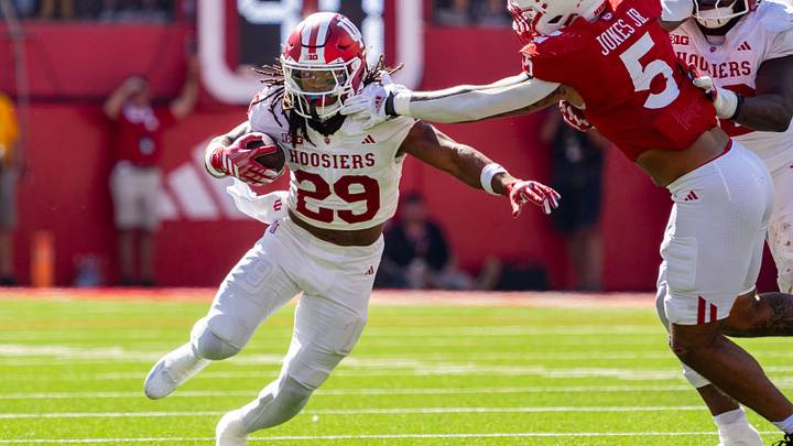Oct 10, 2026; Lincoln, Nebraska, USA; Indiana Hoosiers running back Lee Beebe Jr. (29) runs against Nebraska Cornhuskers defensive lineman Anthony Jones Jr. (5) during the third quarter at Memorial Stadium. Mandatory Credit: Dylan Widger-Imagn Images Oct 10, 2026; Lincoln, Nebraska, USA; Indiana Hoosiers running back Lee Beebe Jr. (29) runs against Nebraska Cornhuskers defensive lineman Anthony Jones Jr. (5) during the third quarter at Memorial Stadium. Mandatory Credit: Dylan Widger-Imagn Images