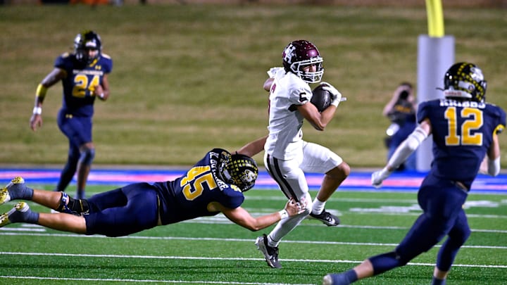 Stephenville linebacker Hudson Butchee tries to tackle Hereford wide receiver Ethan Gonzales.