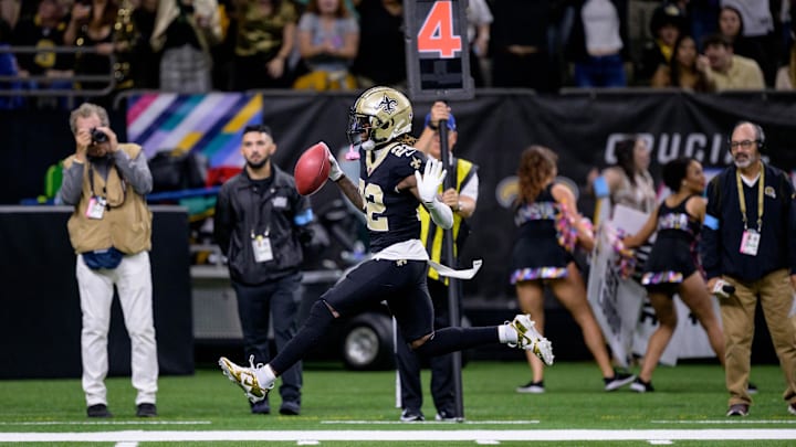 Oct 13, 2024; New Orleans, Louisiana, USA; New Orleans Saints wide receiver Rashid Shaheed (22) returns a punt for a touchdown during the second quarter against the Tampa Bay Buccaneers at Caesars Superdome. Mandatory Credit: Matthew Hinton-Imagn Images