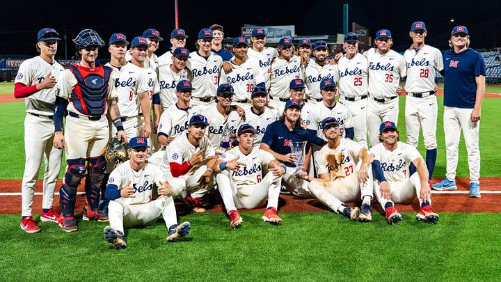 Ole Miss players pose with the trophy after a college baseball game between Ole Miss and Southern Miss