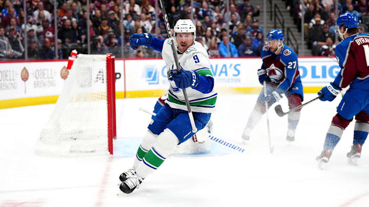 Feb 20, 2024; Denver, Colorado, USA; Vancouver Canucks center J.T. Miller (9) celebrates his goal in