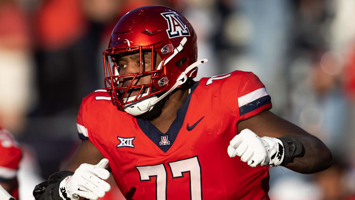 Nov 30, 2024; Tucson, Arizona, USA; Arizona Wildcats offensive lineman Michael Wooten (77) against the Arizona State Sun Devils during the Territorial Cup at Arizona Stadium. Mandatory Credit: Mark J. Rebilas-Imagn Images