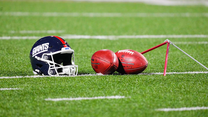 A general view of the New York Giants helmet with footballs A general view of the New York Giants helmet with footballs