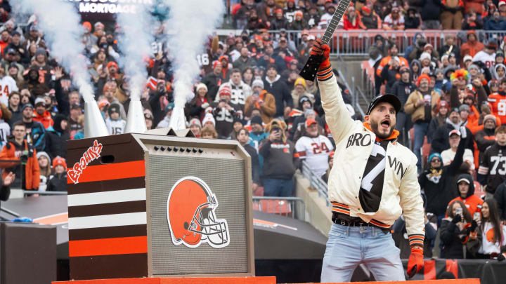 Dec 10, 2023; Cleveland, Ohio, USA; WWE wrestler Johnny Gargano holds up a broken guitar that he smashed before the game between the Cleveland Browns and the Jacksonville Jaguars at Cleveland Browns Stadium. Mandatory Credit: Ken Blaze-USA TODAY Sports