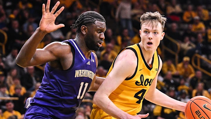 Franck Kepnang and  Iowa forward Riley Mulvey go one-on-one in Saturday's game. 