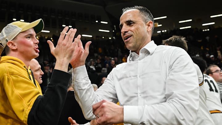 Jan 28, 2026; Iowa City, Iowa, USA; Iowa Hawkeyes head coach Ben McCollum reacts with fans after the game against the Southern California Trojans at Carver-Hawkeye Arena. Mandatory Credit: Jeffrey Becker-Imagn Images