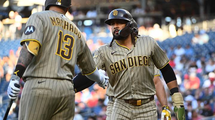 May 29, 2026; Washington, District of Columbia, USA; San Diego Padres second baseman Fernando Tatis Jr. (23) is congratulated by third baseman Manny MacHado (13) after scoring a run against the Washington Nationals during the first inning at Nationals Park. Mandatory Credit: Brad Mills-Imagn Images