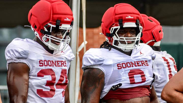 Oklahoma defensive linemen Adepoju Adebawore (34) and David Stone (0) look on at a practice during fall camp. Oklahoma defensive linemen Adepoju Adebawore (34) and David Stone (0) look on at a practice during fall camp.