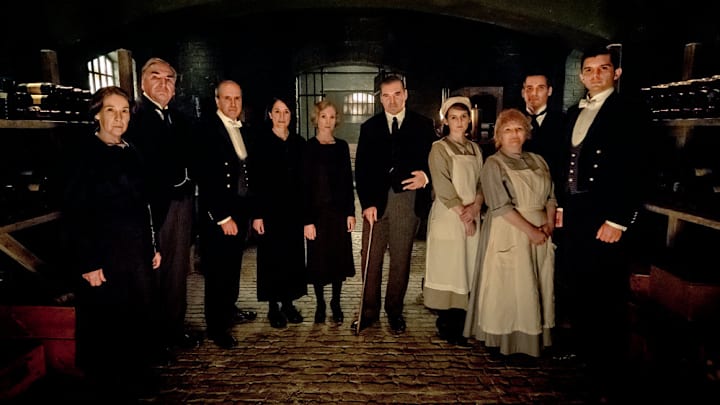 NBC'S RETURN TO DOWNTON ABBEY: A GRAND EVENT -- "Downton Abbey" -- Pictured: (l-r) Phyllis Logan as Mrs. Hughes, Jim Carter as Mr. Carson, Kevin Doyle as Mr. Molesley, Raquel Cassidy as Miss Baxter, Joanne Froggatt as Anna Bates, Brendan Coyle as Mr. Bates, Sophie McShera as Daisy, Lesley Nicol as Mrs. Patmore, Robert James-Collier as Thomas Barrow and Michael C. Fox as Andy -- (Photo by: Jaap Buitendijk/Focus Features)
