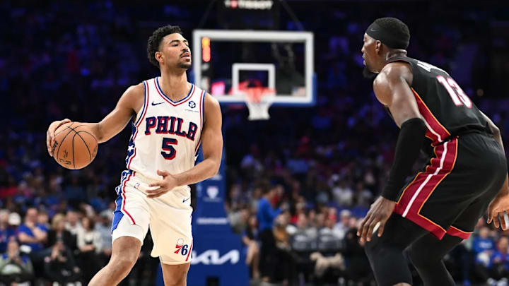 Mar 29, 2025; Philadelphia, Pennsylvania, USA; Philadelphia 76ers guard Quentin Grimes (5) controls the ball against the Miami Heat in the third quarter at Wells Fargo Center. 