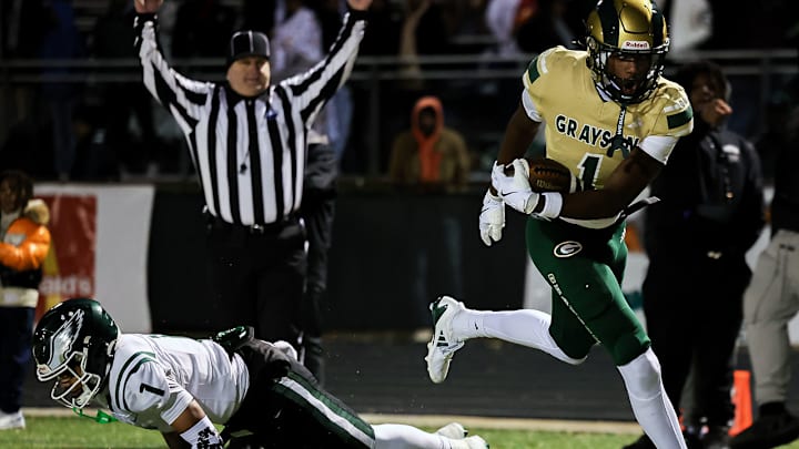 Grayson's Alex Sanchez (1) leaves a Collins Hill defender in his wake as he scores in the Rams' 38-14 Class 6A playoff victory last week.