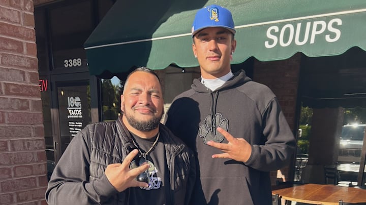 UW tight ends coach Jordan Paopao visits with recruit Kai Wesley in Utah. 
