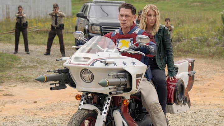 John Cena as Christopher Smith / Peacemaker and Jennifer Holland as Emilia Harcourt in Peacemaker season 2. (Courtesy of HBO Max).