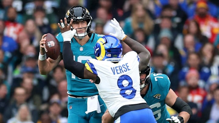 [US, Mexico & Canada customers only] Oct 19, 2025; London, United Kingdom; Los Angeles Rams linebacker Jared Verse (8) defends Jacksonville Jaguars quarterback Trevor Lawrence (16) as Jacksonville Jaguars guard Ezra Cleveland (76) blocks during the first half during a NFL International Series game at Wembley Stadium. Mandatory Credit: Andrew Boyers-Reuters via Imagn Images