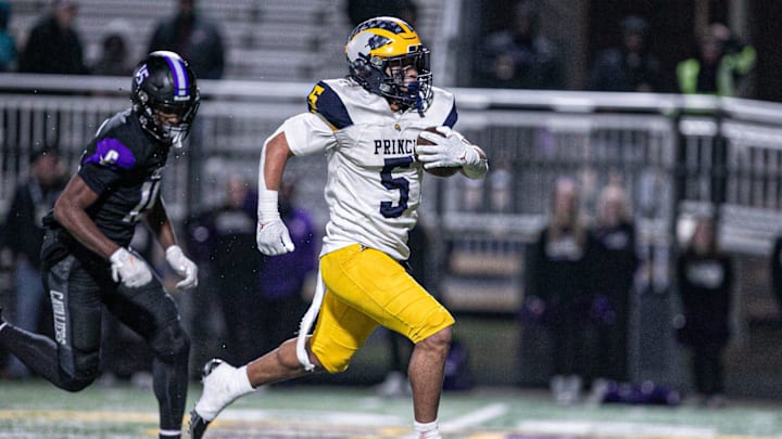 Andrew Beard of Prince Avenue breaks through the middle of Calvary's defense to score a touchdown on Nov. 29, 2024.