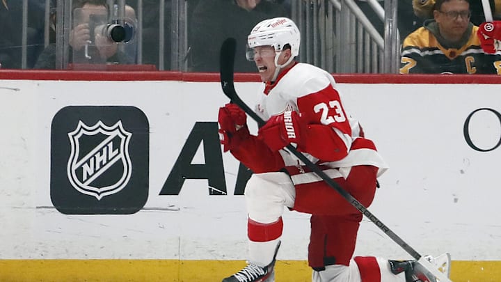Apr 11, 2024; Pittsburgh, Pennsylvania, USA; Detroit Red Wings left wing Lucas Raymond (23) reacts after scoring a goal to complete a hat-trick against the Pittsburgh Penguins during the third period at PPG Paints Arena. Pittsburgh won 6-5 in overtime. Mandatory Credit: Charles LeClaire-Imagn Images Apr 11, 2024; Pittsburgh, Pennsylvania, USA; Detroit Red Wings left wing Lucas Raymond (23) reacts after scoring a goal to complete a hat-trick against the Pittsburgh Penguins during the third period at PPG Paints Arena. Pittsburgh won 6-5 in overtime. Mandatory Credit: Charles LeClaire-Imagn Images
