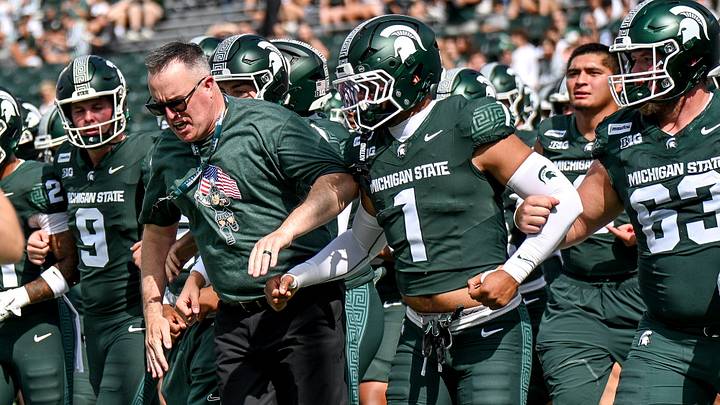 Michigan State’s head coach Pat Fitzgerald, left, and the team gets fired up before the football game against Eastern Michigan on Saturday, Sept. 12, 2026, at Spartan Stadium in East Lansing. Michigan State’s head coach Pat Fitzgerald, left, and the team gets fired up before the football game against Eastern Michigan on Saturday, Sept. 12, 2026, at Spartan Stadium in East Lansing.