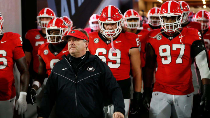 Georgia coach Kirby Smart lead the team onto the field to warm up before the start of a NCAA college football game against Ole Miss in Athens, Ga., on Saturday, Nov. 11, 2023. Georgia coach Kirby Smart lead the team onto the field to warm up before the start of a NCAA college football game against Ole Miss in Athens, Ga., on Saturday, Nov. 11, 2023.