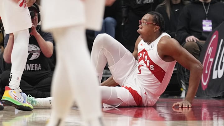 Dec 9, 2024; Toronto, Ontario, CAN; Toronto Raptors forward Scottie Barnes (4) reacts after injuring his leg during the second half against the New York Knicks at Scotiabank Arena. Mandatory Credit: John E. Sokolowski-Imagn Images