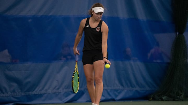 Junior Seren Agar lines up to serve for Boston College 
