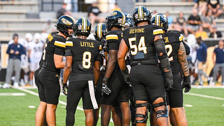 The Southern Miss offense in the huddle during the Golden Eagles' Week 3 matchup against UConn at The Rock. The Southern Miss offense in the huddle during the Golden Eagles' Week 3 matchup against UConn at The Rock.
