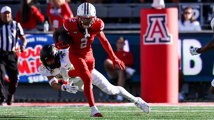Oct 19, 2024; Tucson, Arizona, USA; Arizona Wildcats wide receiver Jeremiah Patterson (2) runs with ball against the Colorado Buffaloes during the fourth quarter at Arizona Stadium. 