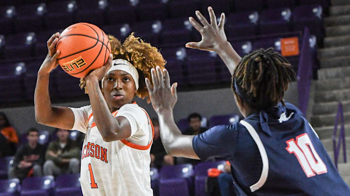 Clemson guard Loyal McQueen (1) takes a shot near Jackson State University guard Diana Berete (10) during the first quarter at Littlejohn Coliseum in Clemson, S.C. Monday, Nov 4, 2024. Clemson guard Loyal McQueen (1) takes a shot near Jackson State University guard Diana Berete (10) during the first quarter at Littlejohn Coliseum in Clemson, S.C. Monday, Nov 4, 2024.