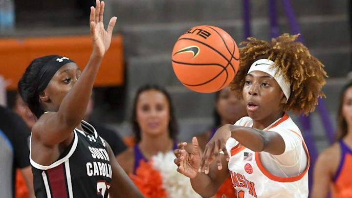 Clemson guard Loyal McQueen (1) passes near South Carolina guard Bree Hall (23) during the second quarter at Littlejohn Coliseum Wednesday, November 20, 2024; Clemson, SC, USA. Clemson guard Loyal McQueen (1) passes near South Carolina guard Bree Hall (23) during the second quarter at Littlejohn Coliseum Wednesday, November 20, 2024; Clemson, SC, USA.
