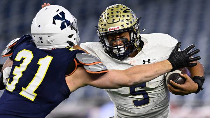 Needham senior Aidan Williams runs the ball while closely defended by Xaverian junior Dominic Funke during the MIAA Division 1 Super Bowl game at Gillette Stadium, Thursday, Dec. 5, 2024. Xaverian defeated Needham, 14-7, to become the Division 1 state champions. Needham senior Aidan Williams runs the ball while closely defended by Xaverian junior Dominic Funke during the MIAA Division 1 Super Bowl game at Gillette Stadium, Thursday, Dec. 5, 2024. Xaverian defeated Needham, 14-7, to become the Division 1 state champions.