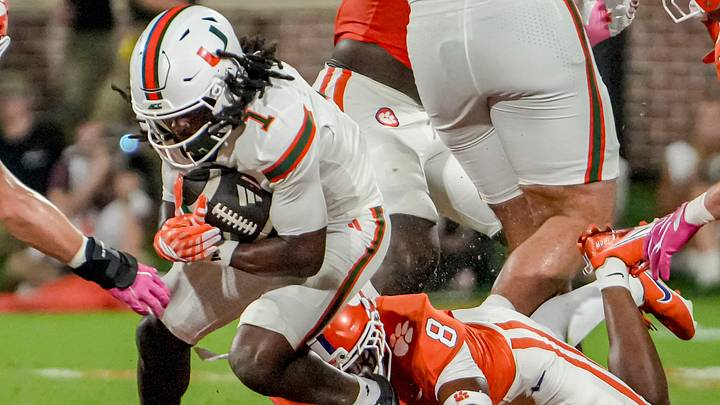 Miami Hurricanes wide receiver Malachi Toney (1) is tackled by Clemson cornerback Corian Gipson (8) during the first quarter at Memorial Stadium Saturday, October 3, 2026.