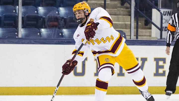 Mar 14, 2021; South Bend, Indiana, USA; Minnesota's Brock Faber (14) shoots against Michigan State at the Compton Family Ice Arena.