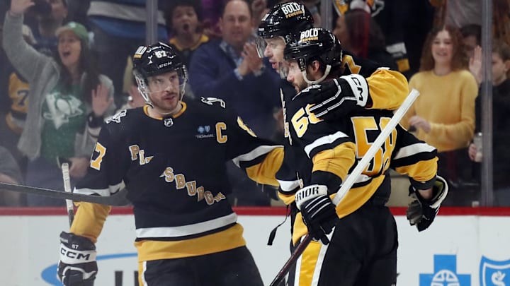 Mar 28, 2024; Pittsburgh, Pennsylvania, USA; Pittsburgh Penguins center Sidney Crosby (87) and defenseman Kris Letang (58) congratulate center Evgeni Malkin (middle) on his power play goal against the Columbus Blue Jackets during the second period at PPG Paints Arena. The Penguins won 3-2. Mandatory Credit: Charles LeClaire-Imagn Images