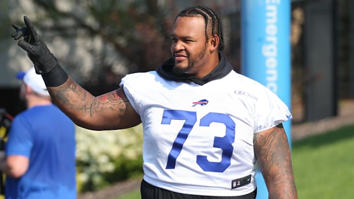 Bills offensive lineman Dion Dawkins waves to fans as he heads to the field on the opening day of Buffalo Bills training camp.
