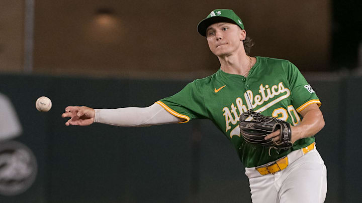 Sep 8, 2025; West Sacramento, California, USA; Athletics second base Zack Gelof (20) throws the ball to first base against the Boston Red Sox during the third inning at Sutter Health Park. Mandatory Credit: Ed Szczepanski-Imagn Images