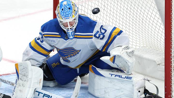 Mar 15, 2026; Winnipeg, Manitoba, CAN; A puck flies over St. Louis Blues goaltender Jordan Binnington (50) during a game against the Winnipeg Jets in the second period at Canada Life Centre. Mandatory Credit: James Carey Lauder-Imagn Images