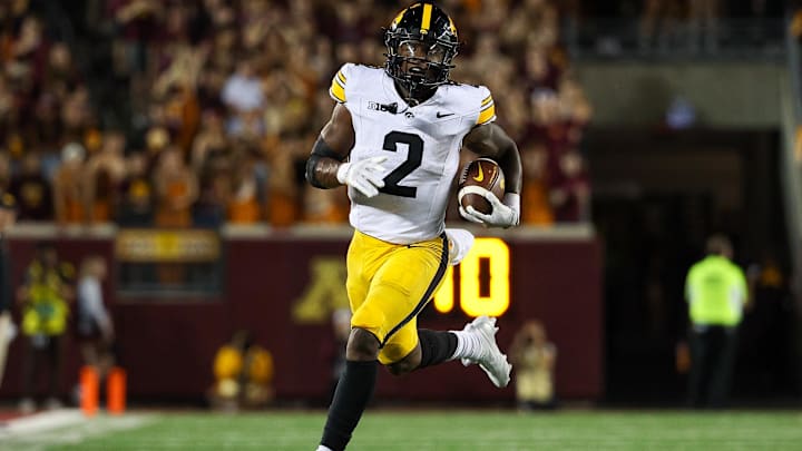 Sep 21, 2024; Minneapolis, Minnesota, USA; Iowa Hawkeyes running back Kaleb Johnson (2) runs the ball against the Minnesota Golden Gophers during the second half at Huntington Bank Stadium. Sep 21, 2024; Minneapolis, Minnesota, USA; Iowa Hawkeyes running back Kaleb Johnson (2) runs the ball against the Minnesota Golden Gophers during the second half at Huntington Bank Stadium.
