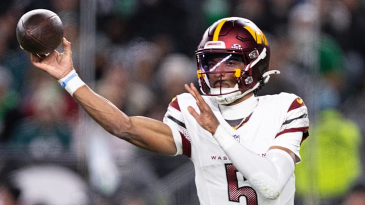 Nov 14, 2024; Philadelphia, Pennsylvania, USA; Washington Commanders quarterback Jayden Daniels (5) throws the ball against the Philadelphia Eagles during the second quarter at Lincoln Financial Field. Mandatory Credit: Bill Streicher-Imagn Images