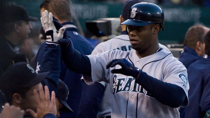 Seattle Mariners outfielder Ken Griffey Jr. celebrates after scoring against the Oakland Athletics on April 10, 2009, at Oakland Coliseum. Seattle Mariners outfielder Ken Griffey Jr. celebrates after scoring against the Oakland Athletics on April 10, 2009, at Oakland Coliseum.