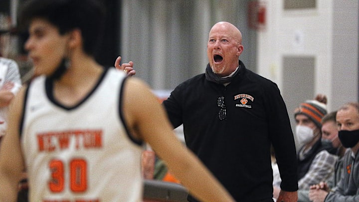 Newton North Head Coach Paul Connolly yelled instructions to his team in the closing minutes of the game against Wellesley, March 4, 2022.