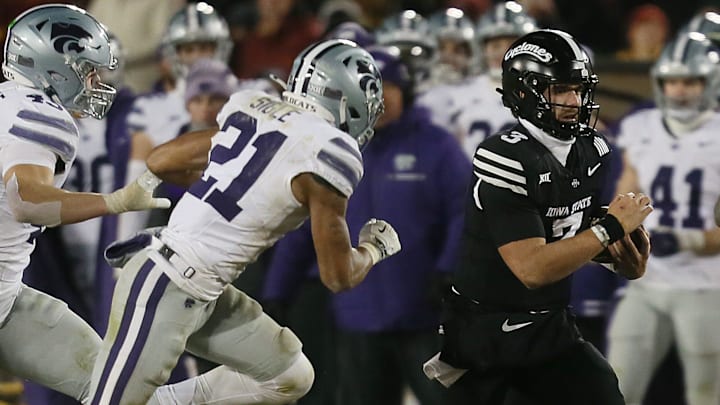 Iowa State Cyclones quarterback Rocco Becht (3) runs with the ball for a first down around Kansas State Wildcats safety Marques Sigle (21) and linebacker Austin Romaine (45) during the fourth quarter in the NCAA football at Jack Trice Stadium on Saturday, Nov. 30, 2024, in Ames, Iowa.