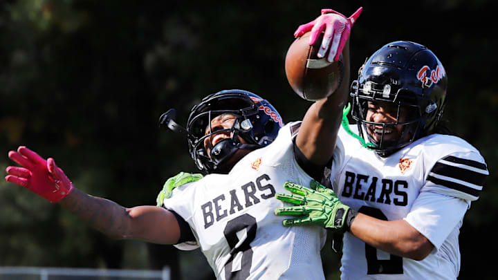 Clairton's Brandon Murphy, left, celebrates with Donte Wright after catching a  37-yard touchdown pass from Jeffrey Thompson Saturday at Riverside Park in Oakmont. Murphy scored twice and the Bears rolled to a 66-0 win.