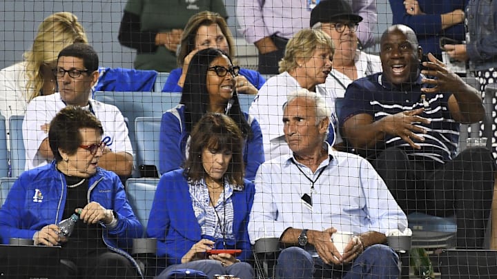 Dodgers part-owner Billie Jean King (left) sits with former pitcher Sandy Koufax (bottom right) and part owner Magic Johnson during the fourth inning in game one of the 2019 NLDS playoff baseball series between the Los Angeles Dodgers and the Washington Nationals at Dodger Stadium on Oct. 3, 2019.