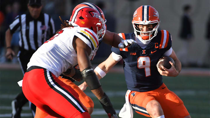 Nov 15, 2025; Champaign, Illinois, USA; Illinois Fighting Illini quarterback Luke Altmyer (9) runs with the football during the first half against the Maryland Terrapins at Memorial Stadium. Mandatory Credit: Ron Johnson-Imagn Images