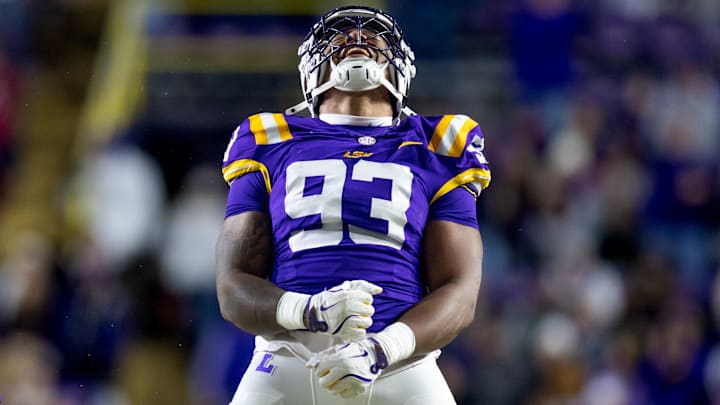 Nov 30, 2024; Baton Rouge, Louisiana, USA; LSU Tigers defensive tackle Ahmad Breaux (93) reacts to making a tackle against Oklahoma Sooners running back Sam Franklin (20) during the fourth quarter at Tiger Stadium. Mandatory Credit: Stephen Lew-Imagn Images Nov 30, 2024; Baton Rouge, Louisiana, USA; LSU Tigers defensive tackle Ahmad Breaux (93) reacts to making a tackle against Oklahoma Sooners running back Sam Franklin (20) during the fourth quarter at Tiger Stadium. Mandatory Credit: Stephen Lew-Imagn Images
