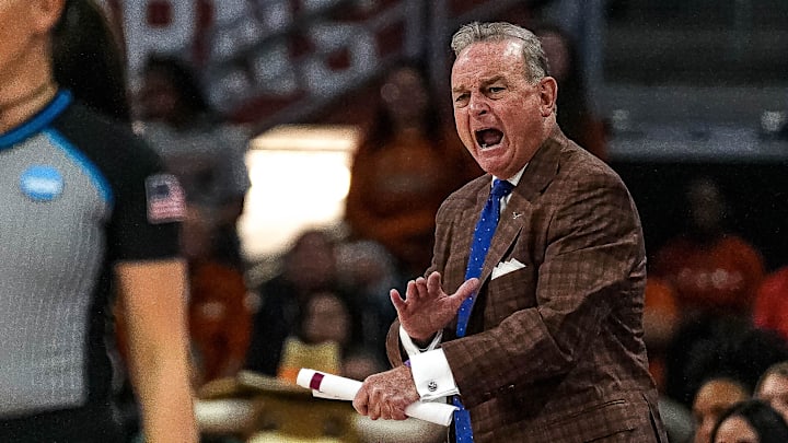 Texas Longhorns head coach Vic Schaefer yells instructions from the sideline during the NCAA playoffs.